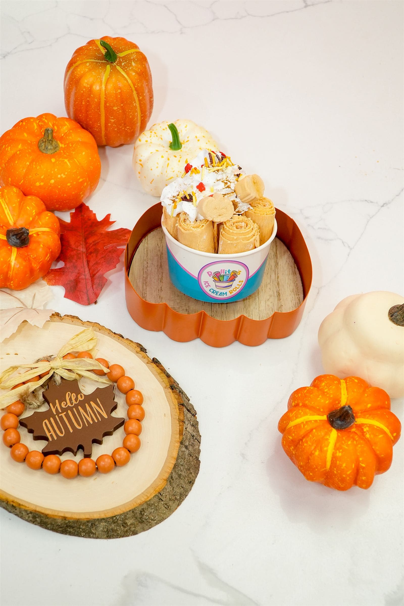 Fall-themed dessert spread with mini pumpkins